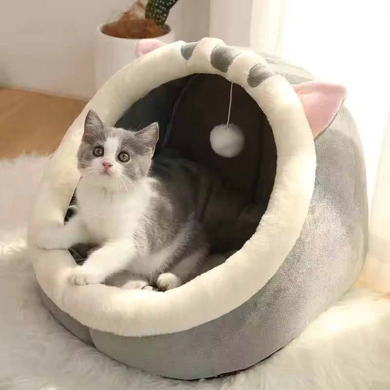 Pet Supplies Eco-Friendly 100% Cotton Pet Bed Cat lying in a gray and white pet bed with pink ears on a fluffy surface.
