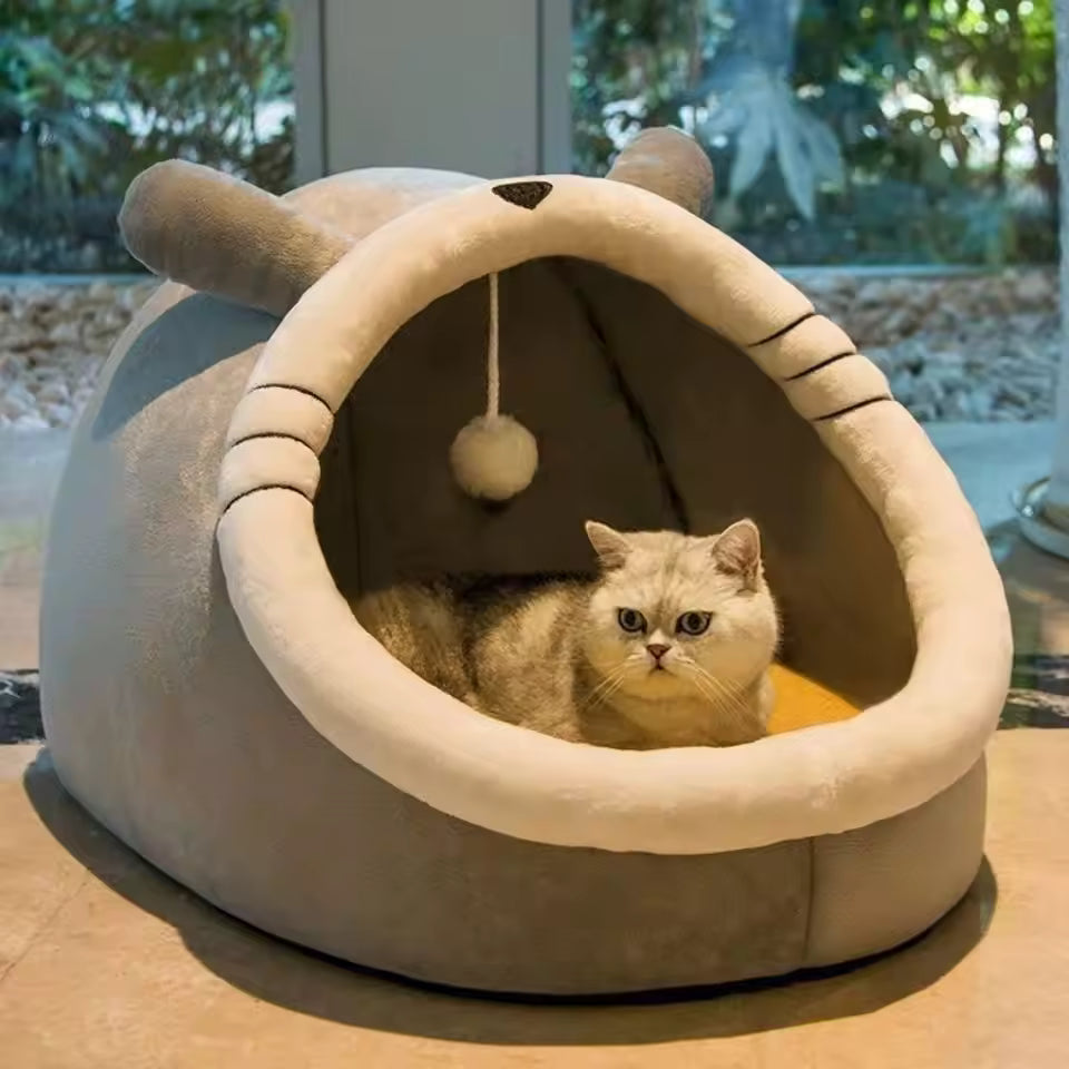 Pet Supplies Eco-Friendly 100% Cotton Pet Bed Cat lying inside a beige pet bed with cat-like design on a wooden surface.