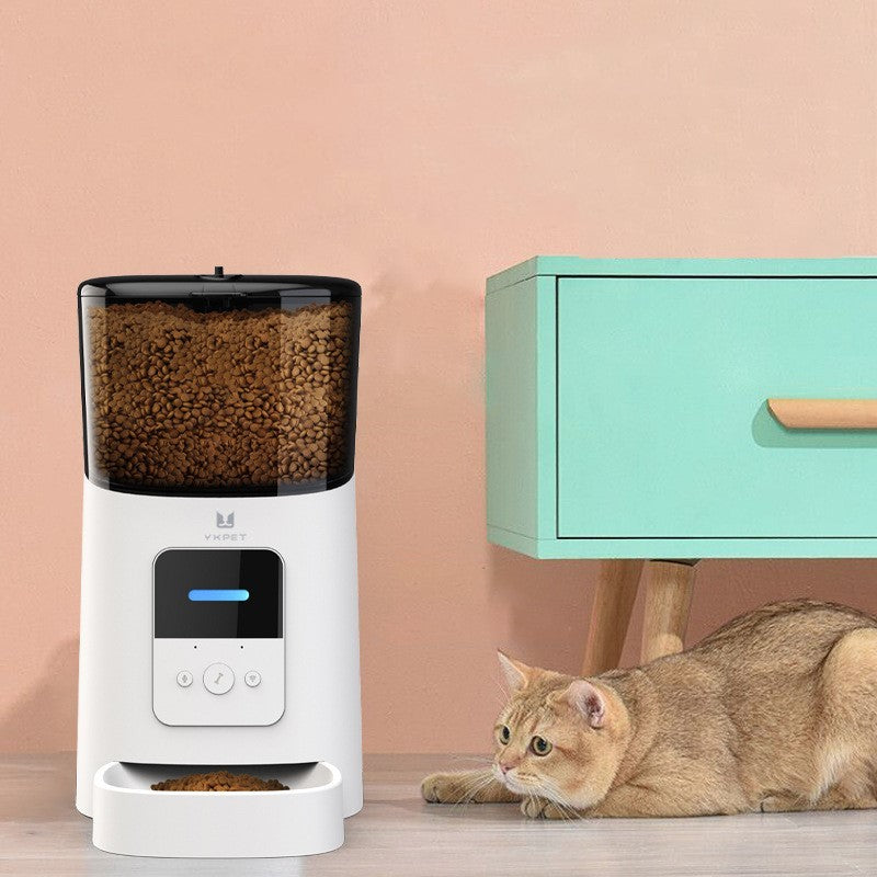 Pet Supplies Smart Automatic A White pet automatic feeder with a clear container filled with brown pet food, and a digital control panel on the front with image of a cat lying down