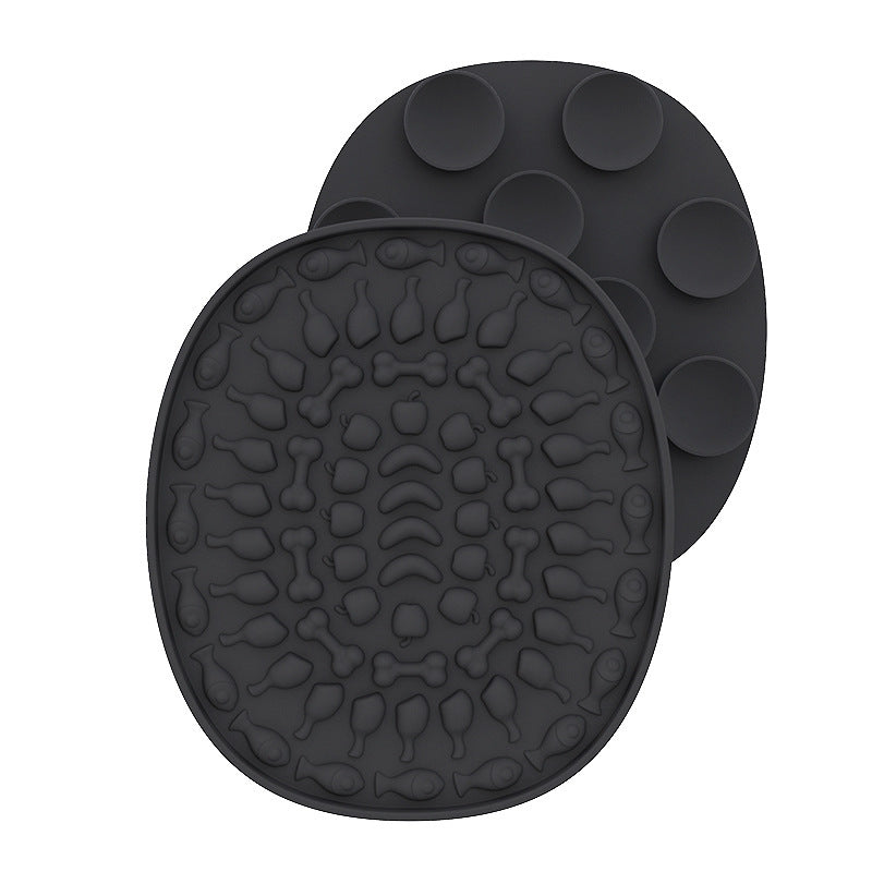 Pet Placemat Silicone Slow Food Mat A silicone pet bowl mat in a dark with a textured design, resembling a placemat, used to slow down the feeding process.
