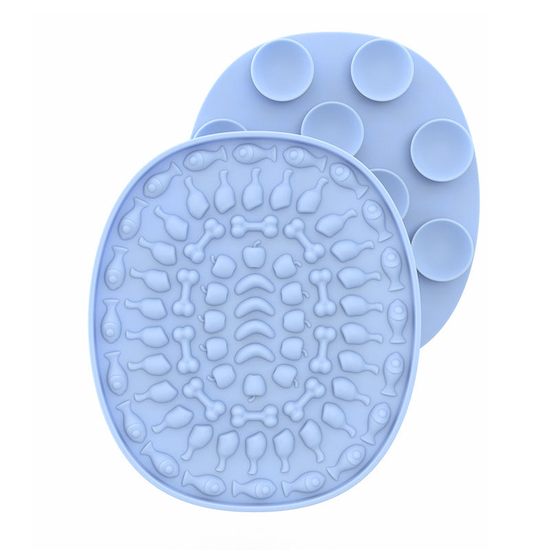 Pet Placemat Silicone Slow Food Mat A silicone pet bowl mat in a light blue color with a textured design, resembling a placemat, used to slow down the feeding process.