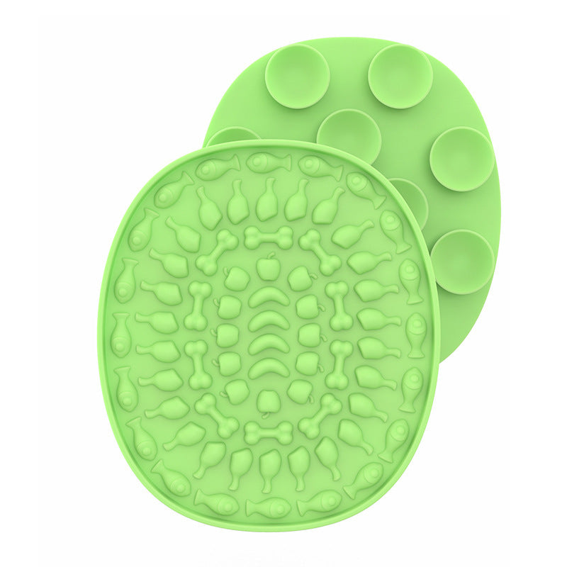 Pet Placemat Silicone Slow Food Mat A silicone pet bowl mat in a light green with a textured design, resembling a placemat, used to slow down the feeding process.