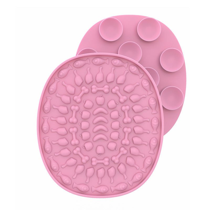 Pet Placemat Silicone Slow Food Mat A silicone pet bowl mat in a pink color with a textured design, resembling a placemat, used to slow down the feeding process.