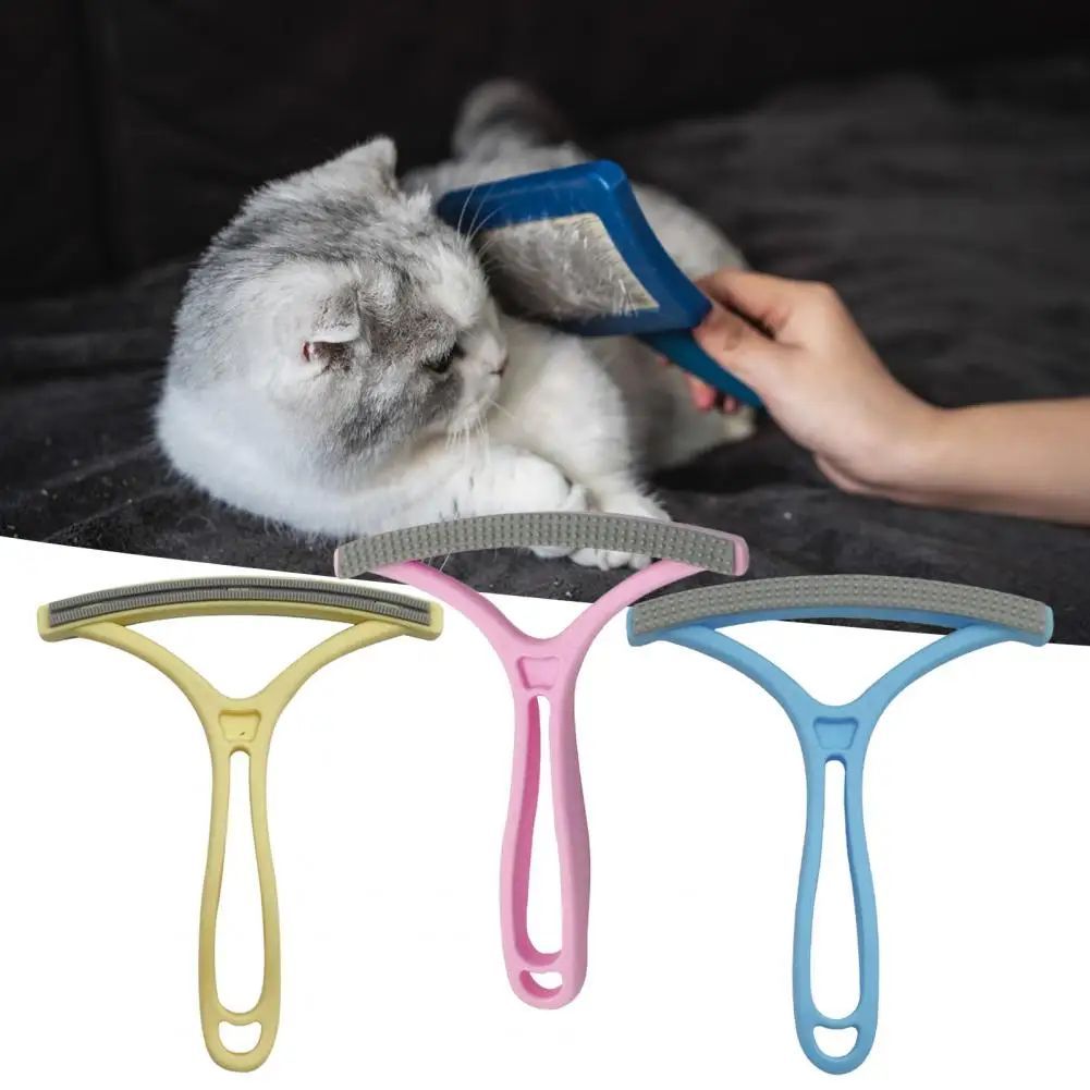Pet Supplies Double-Sided Pet Hair Removal Brush Three double-sided pet hair removal tools in yellow, pink, and blue colors, with one tool being used to comb a cat's fur.