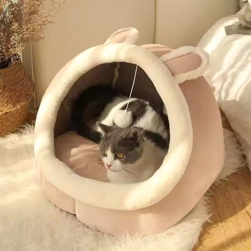 Pet Supplies Eco-Friendly 100% Cotton Pet Bed Cat lying inside a pink pet bed with bunny ears on a soft surface.