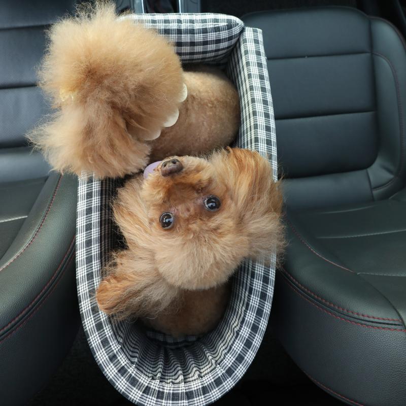 Pet Supplies Portable Pet Dog Carrier, white and black color in a car, between the car set and a dog in the bag